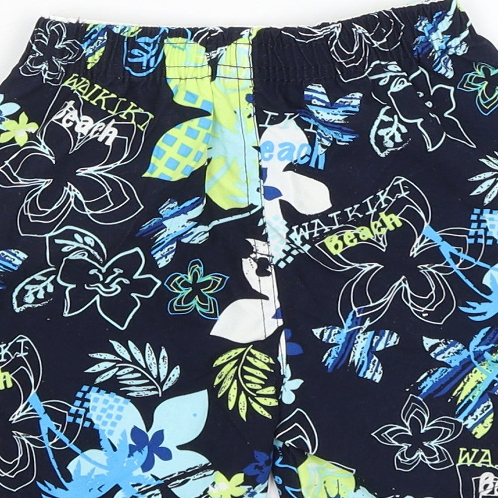 Brand and care label for Early Days Baby Blue Floral Cropped Trousers, size 12-18, Months - Swim
