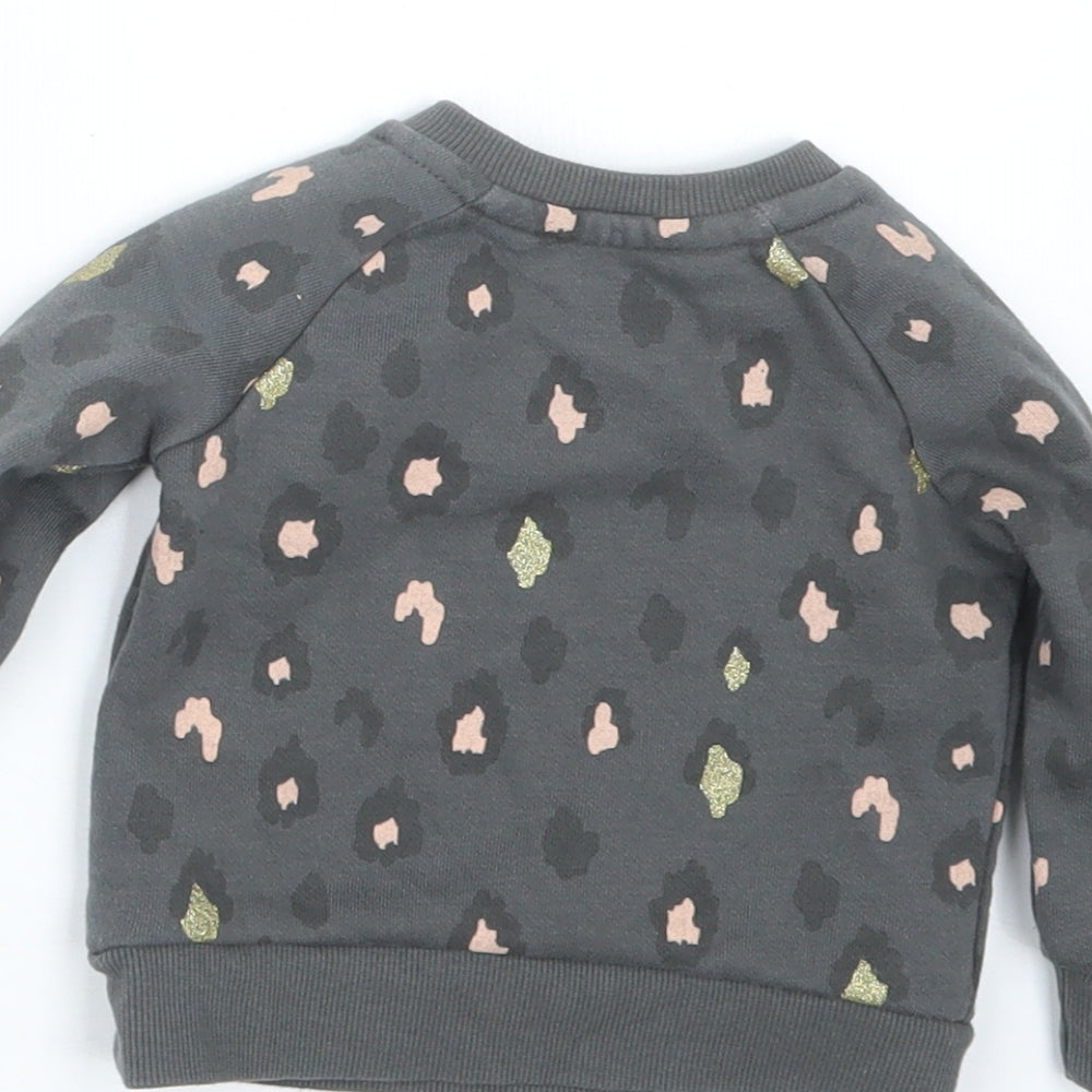 Brand and care label for Primark girls’ grey animal print jumper, size 3-6, months