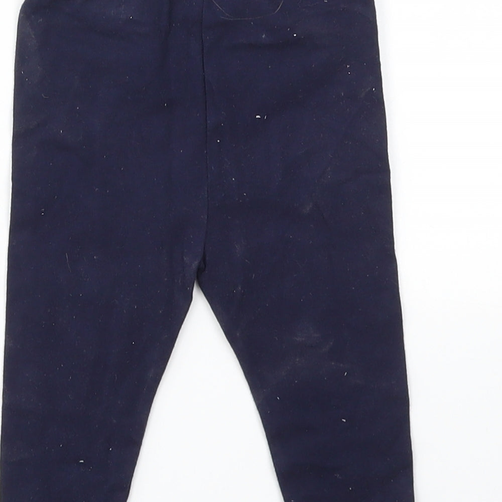 Brand and care label for Gap girls’ blue capri leggings, size 6-9, months