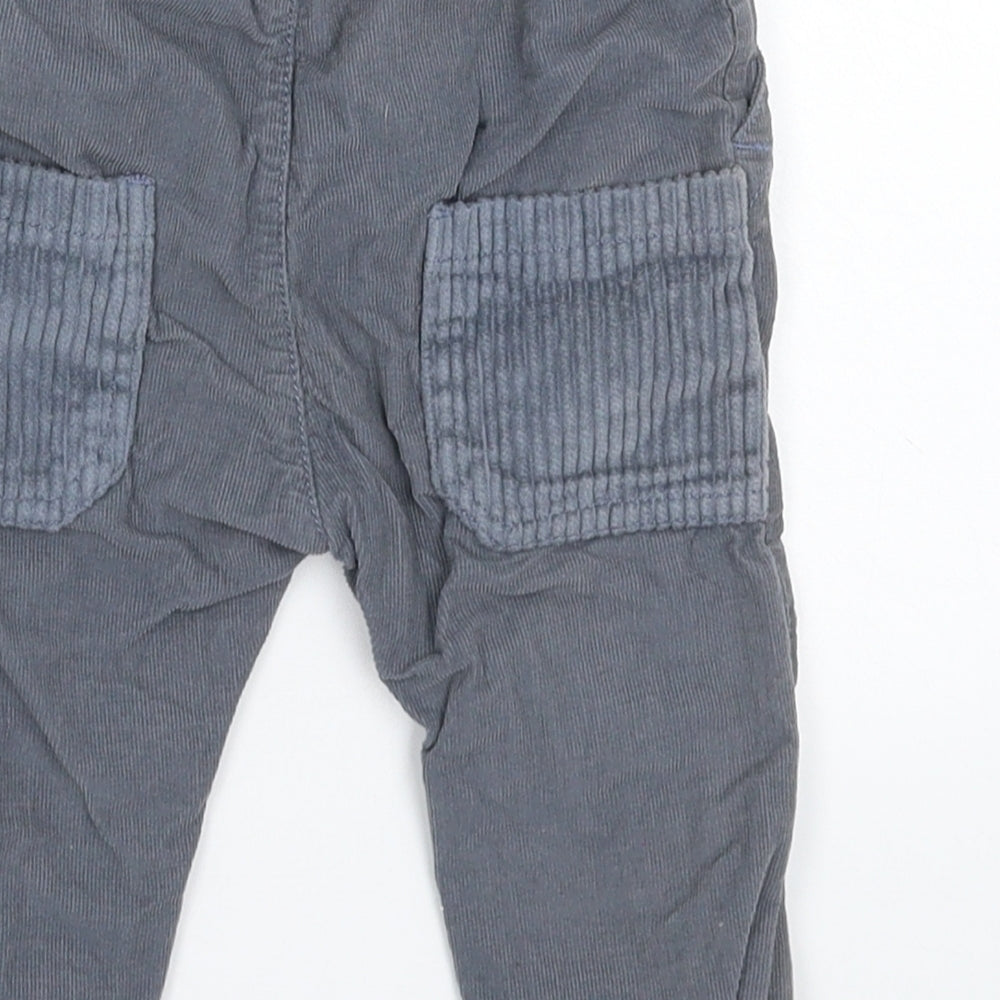 Brand and care label for Nutmeg Baby Grey Corduroy Capri Trousers, size 9, Months