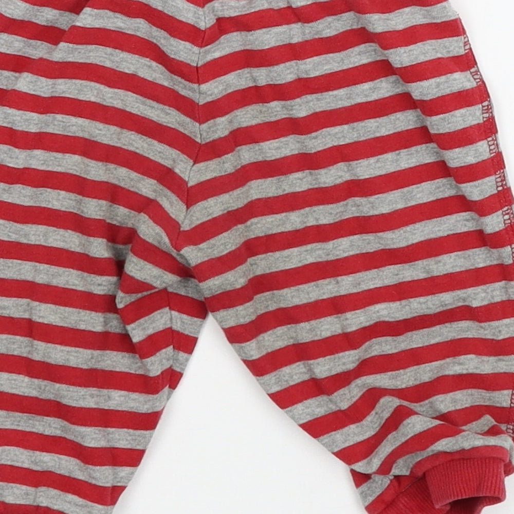 Brand and care label for H&M boys’ red striped jersey jogger trousers, size 3-6, months