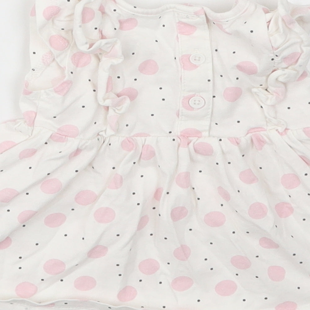 Brand and care label for Matalan girls’ multicoloured polka dot fit & flare size newborn