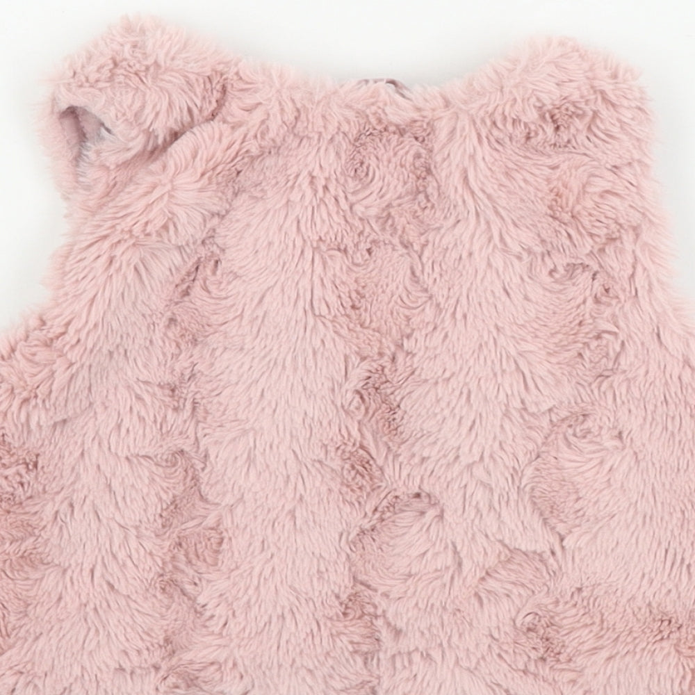 Brand and care label for H&M girls’ pink gilet coat, size 2, years