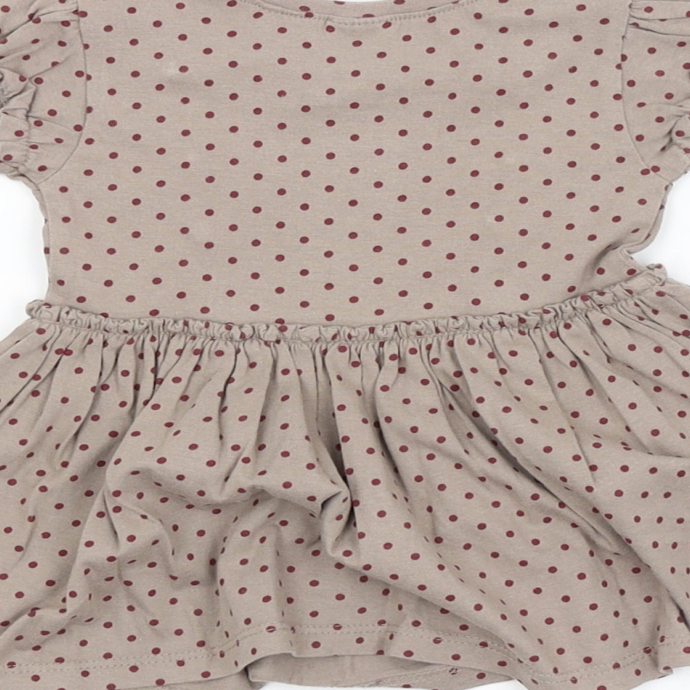 Brand and care label for Next girls’ brown spotted a-line
