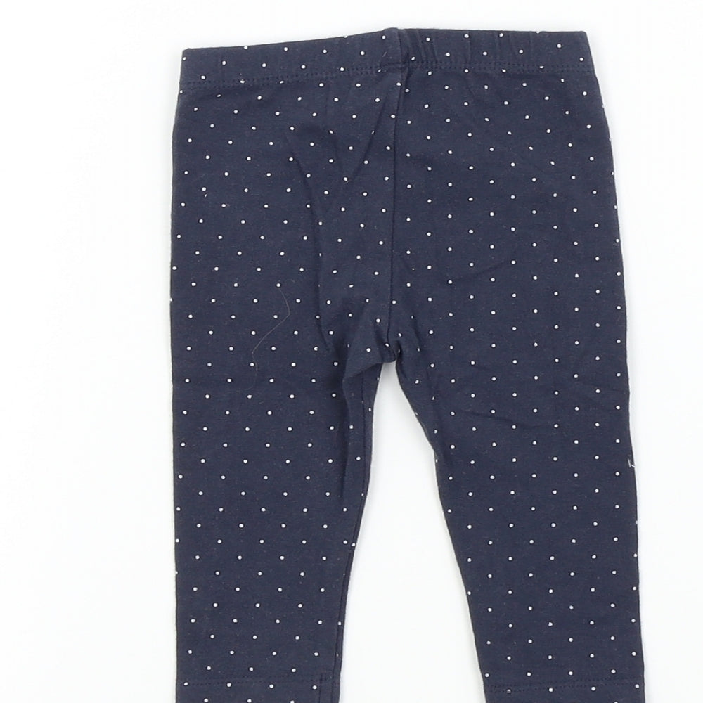 Brand and care label for Nutmeg boys’ blue spotted jogger leggings, size 3-6, months