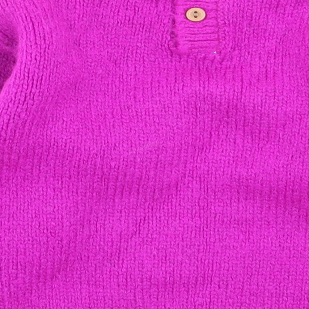Brand and care label for Next girls’ purple jumper, size 3-6, months