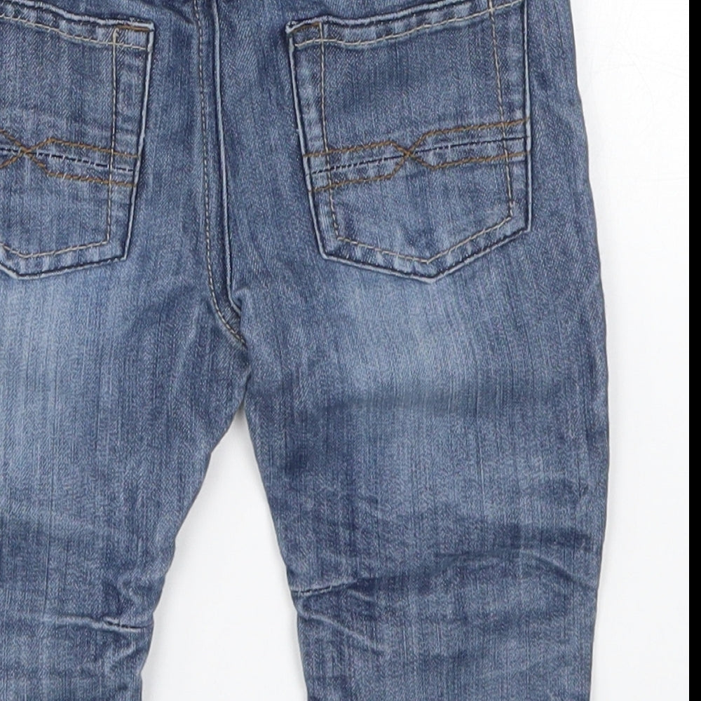 Brand and care label for Matalan boys’ blue denim capri jeans, size 9-12, months