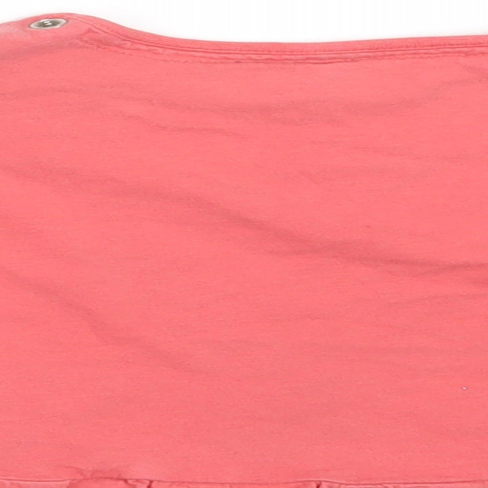 Brand and care label for Tu girls’ pink basic t-shirt, size 12-18, months