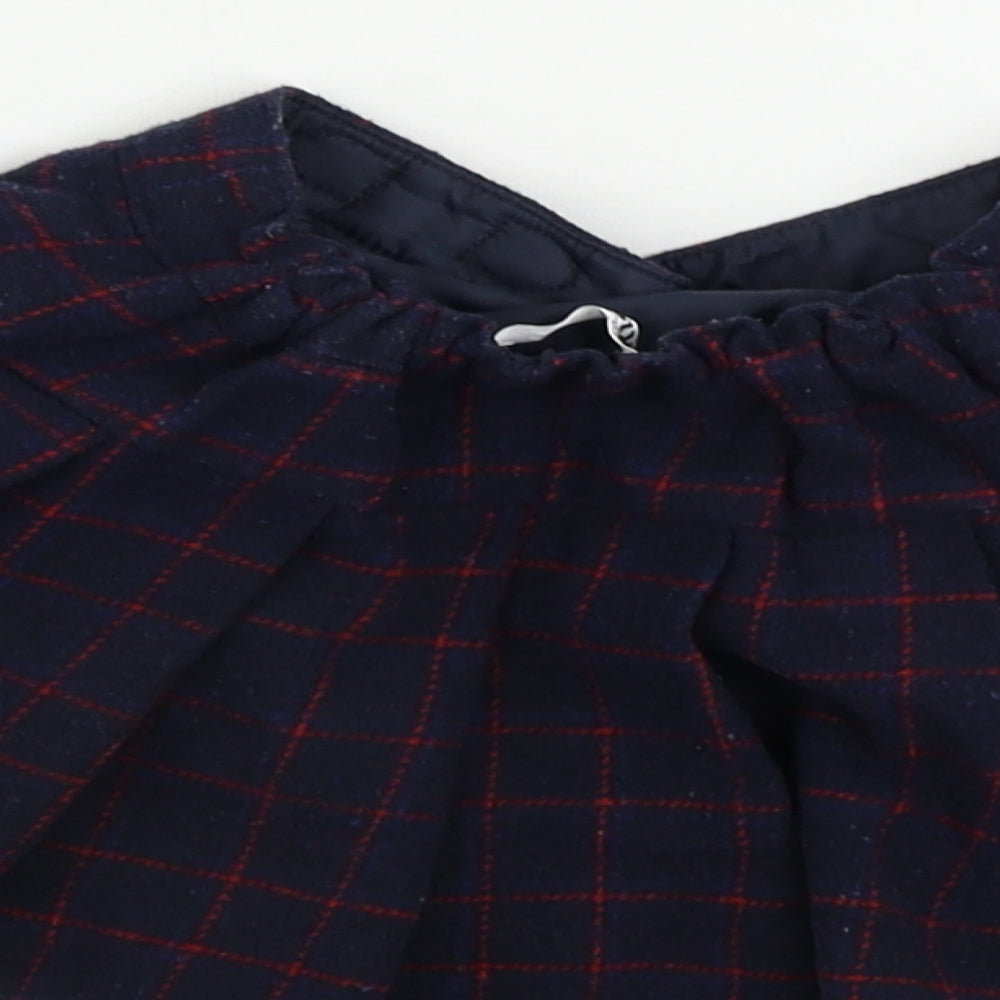 Brand and care label for M&Co girls’ blue check a-line skirt, size 12-18, months