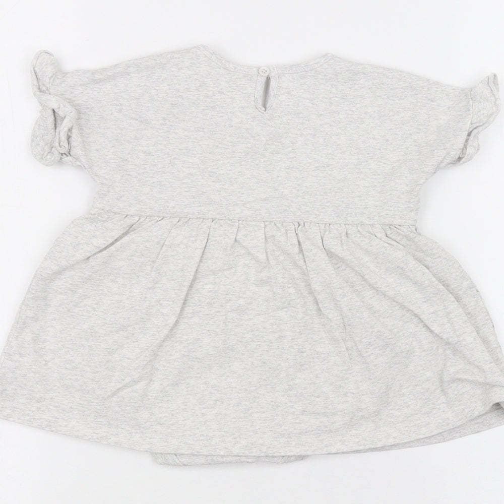 Brand and care label for Disney Baby Grey A-Line, size 9-12, Months