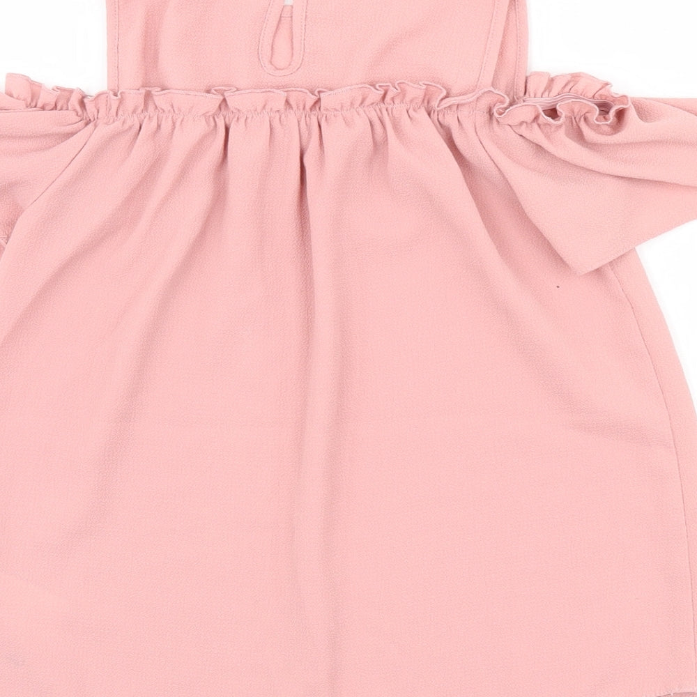 Brand and care label for Primark girls’ pink basic blouse, size 9-10, years
