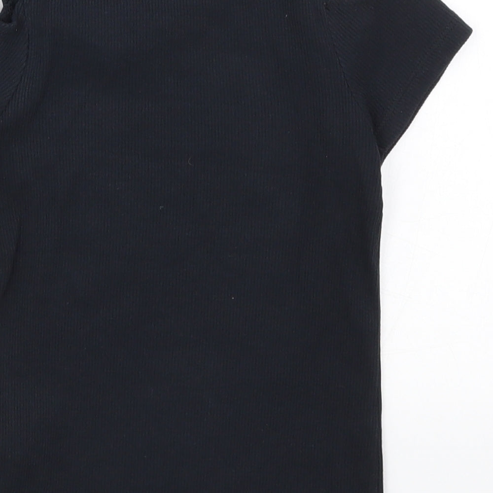 Brand and care label for F&F girls’ black basic t-shirt, size 7-8, years