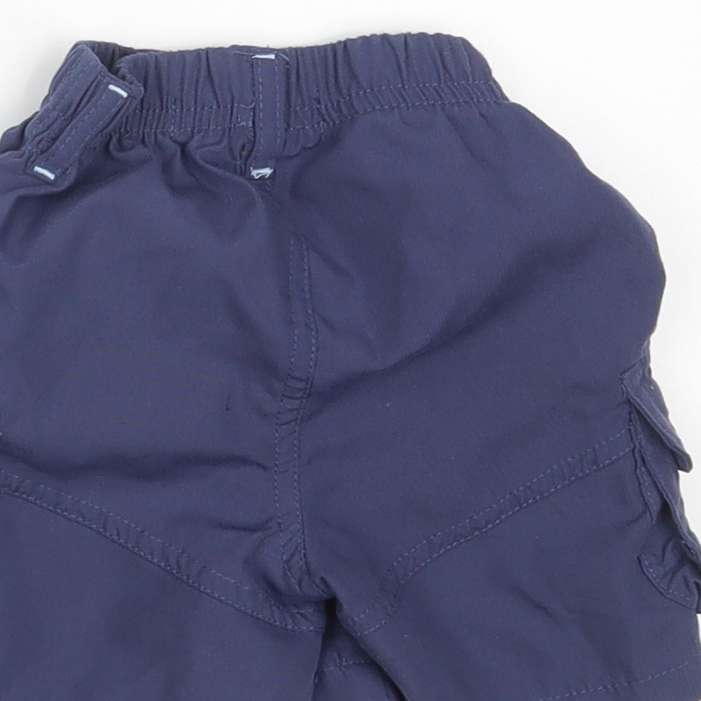 Brand and care label for Nursery Time Baby Blue Cargo Trousers, size 6-9, Months - Waist 14in; Inside leg 4in