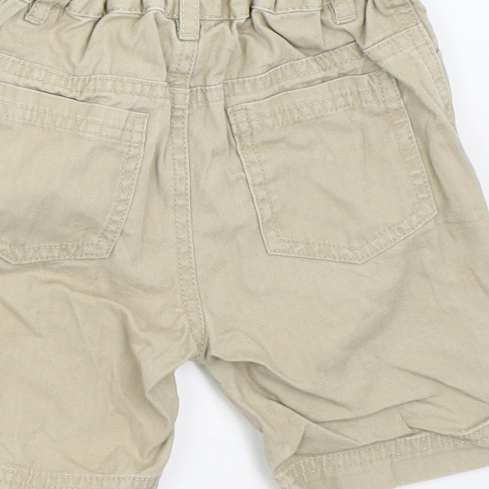 Brand and care label for Baby Club boys’ beige cropped trousers, size 12, months
