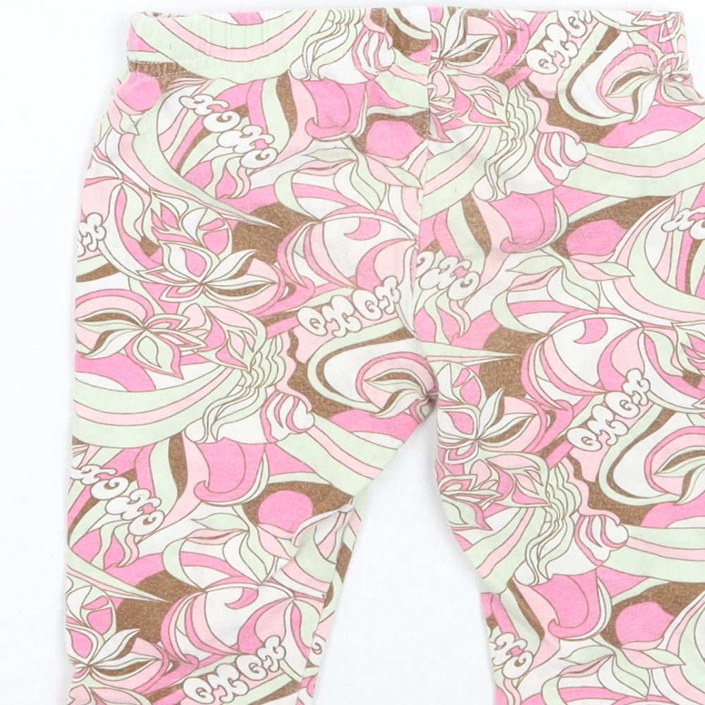 Brand and care label for Xoxo girls’ pink floral cropped leggings, size 24, months