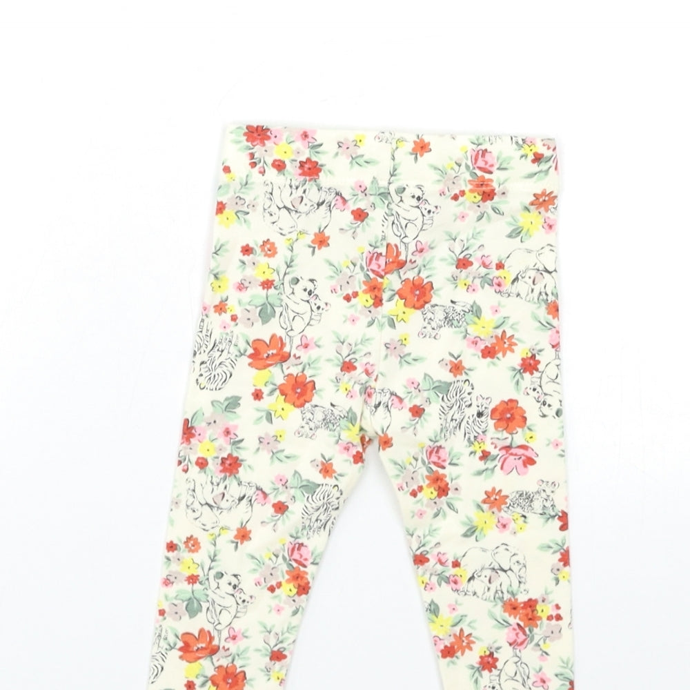 Brand and care label for Nutmeg Baby Beige Floral Capri Trousers, size 3-6, Months