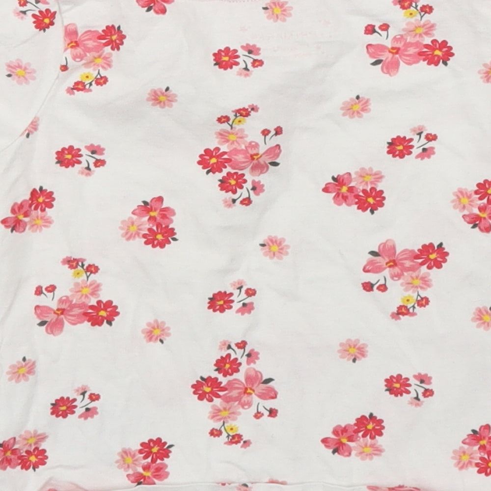 Brand and care label for Primark girls’ pink floral basic t-shirt, size 12-18, months