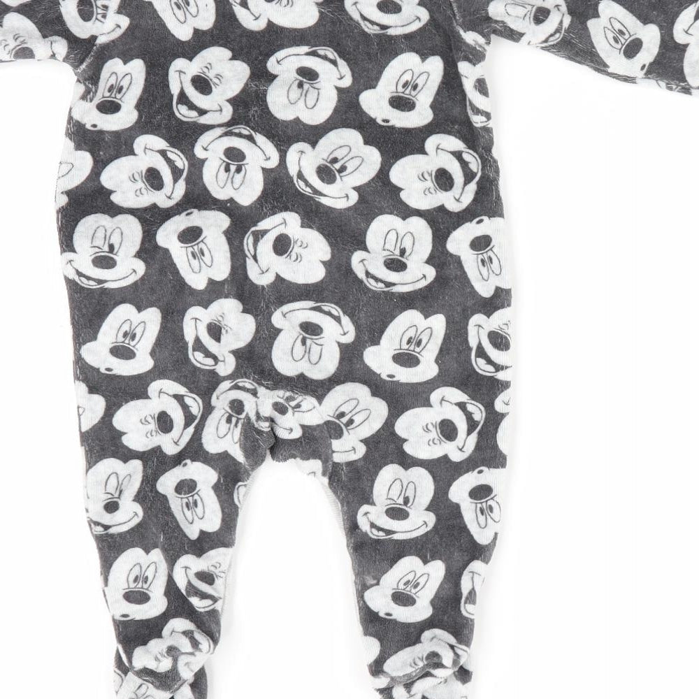 Brand and care label for Disney Baby at George boys’ grey animal print romper one-piece, size 0-3, months - mickey mouse