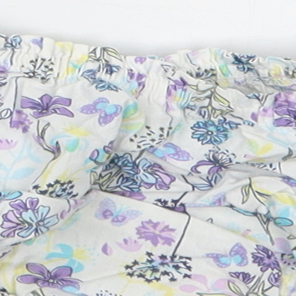 Brand and care label for Pumpkin Patch girls’ purple floral cropped trousers, size 3-6, months