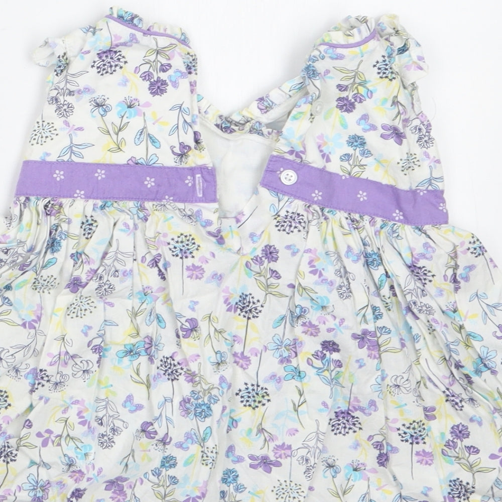 Brand and care label for Pumpkin Patch girls’ purple floral t-shirt dress, size 3-6, months