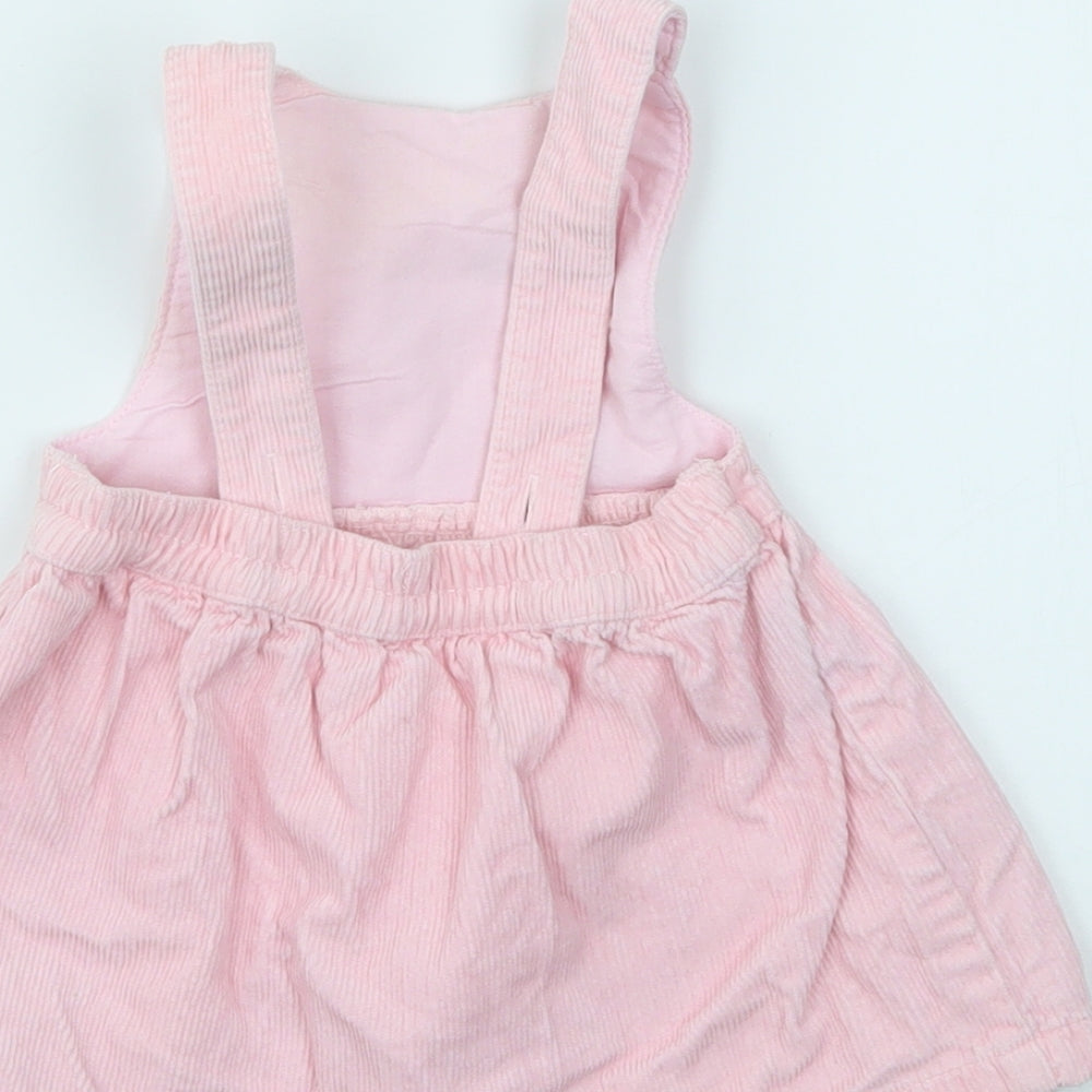 Brand and care label for Mini Club girls’ pink fit & flare, size 3-6, months