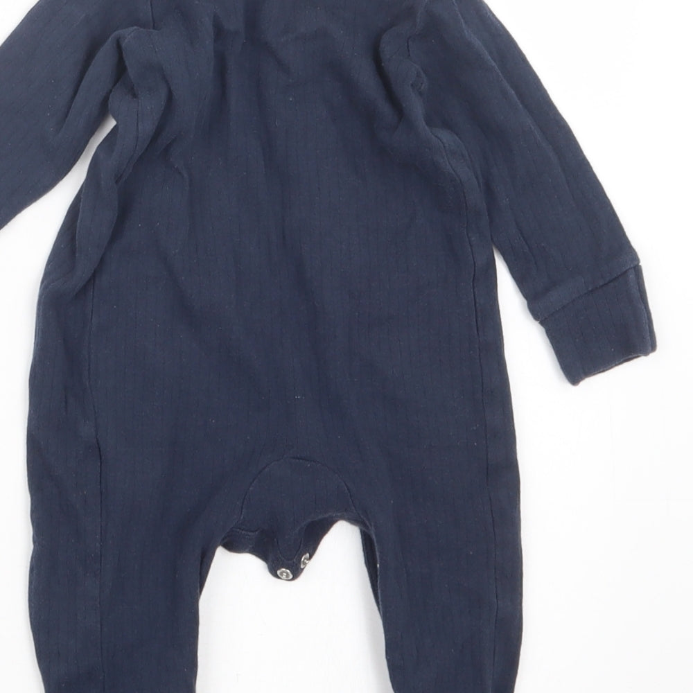 Brand and care label for Very boys’ blue geometric babydoll one piece, size 3-6, months