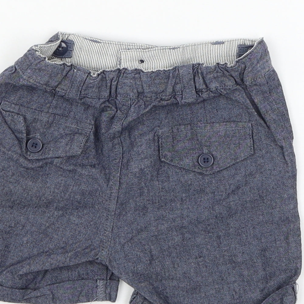 Brand and care label for La Redoute boys’ blue cropped trousers, size 18, months