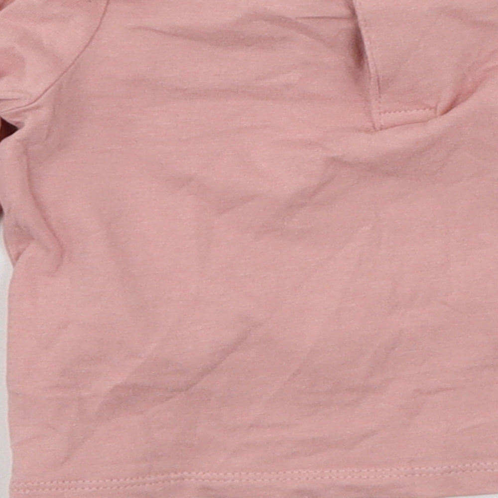 Brand and care label for F&F girls’ pink jersey basic t-shirt, size 0-3, months