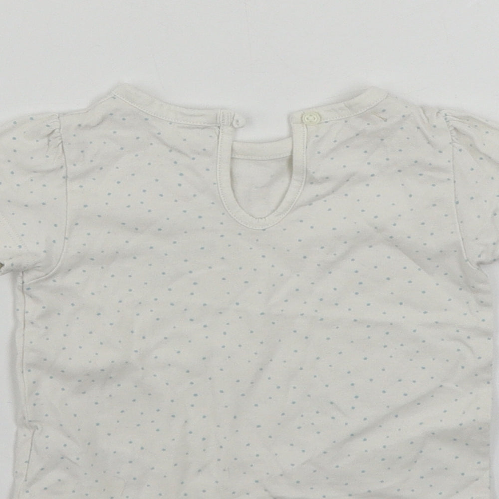 Brand and care label for Marks & Spencer girls’ white polka dot basic t-shirt, size 3-6, months