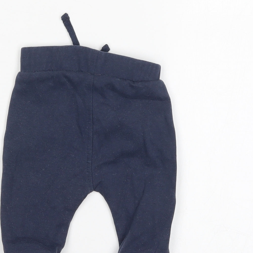 Brand and care label for George Baby Blue sweatpants, size 0-3, Months