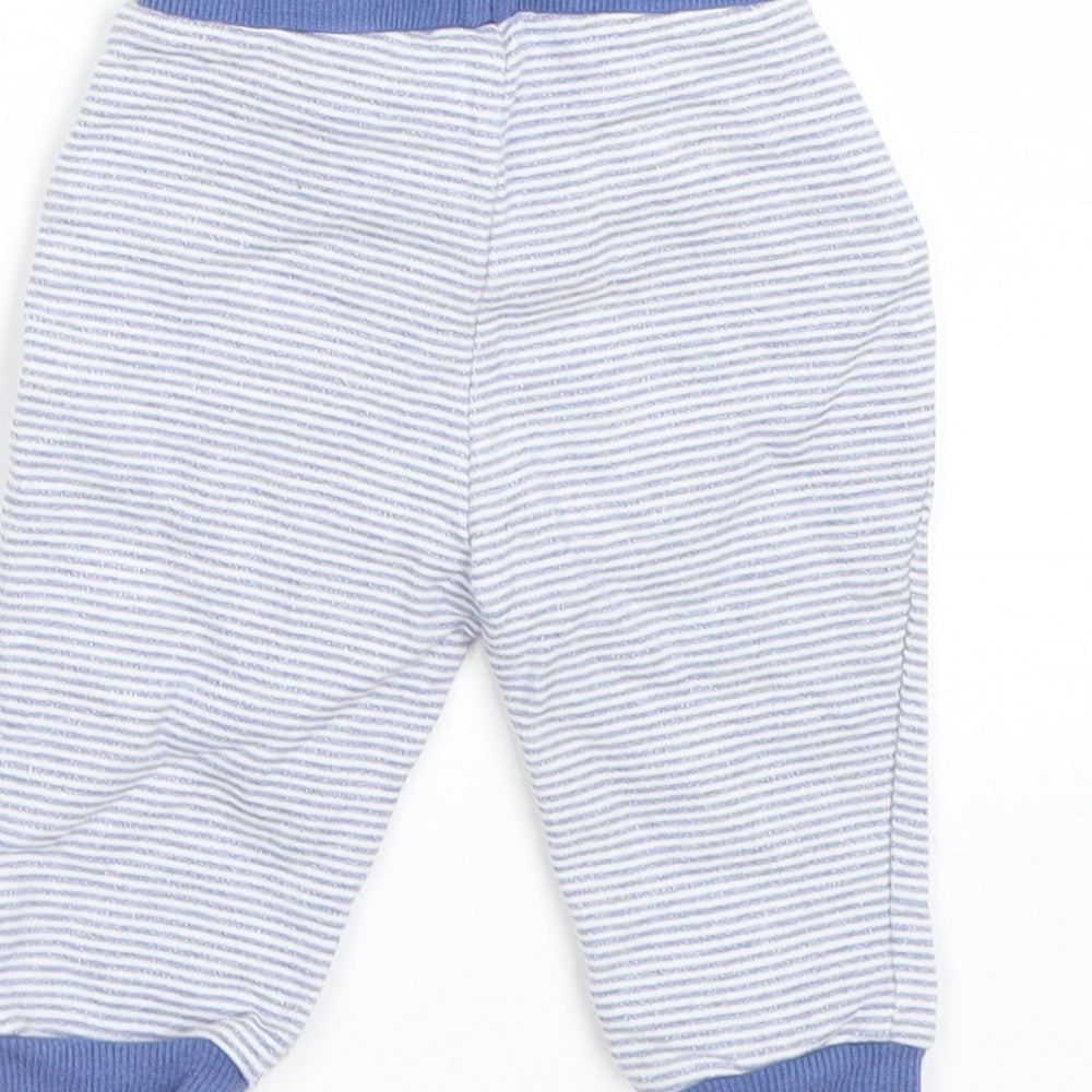 Brand and care label for Matalan boys’ blue striped sweatpants, size 3-6, months