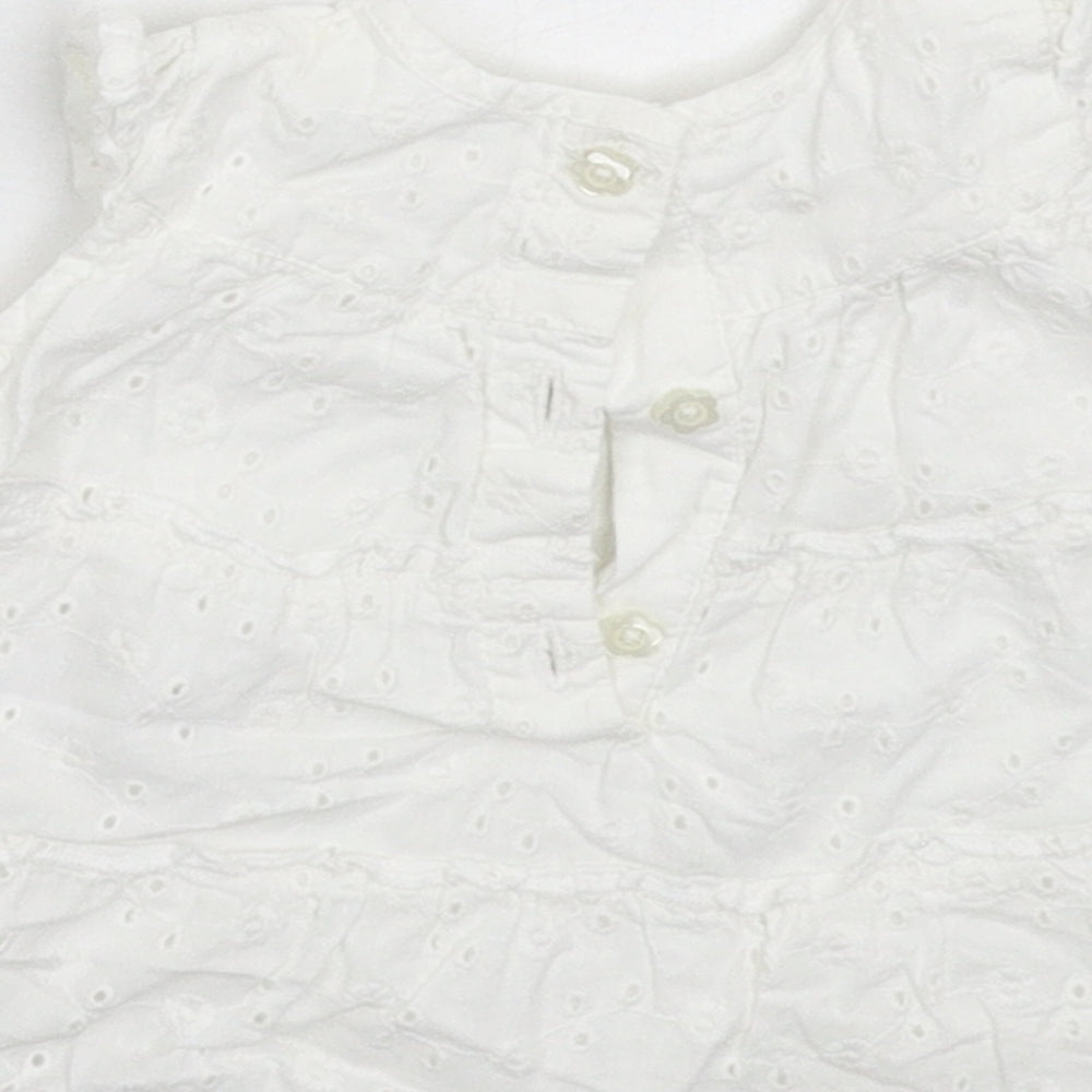 Brand and care label for George girls’ white fit & flare size newborn