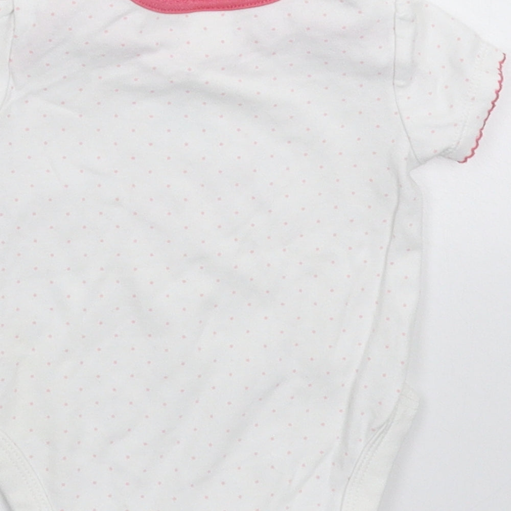 Brand and care label for Mini Club girls’ white spotted babygrow one-piece, size 3-6, months