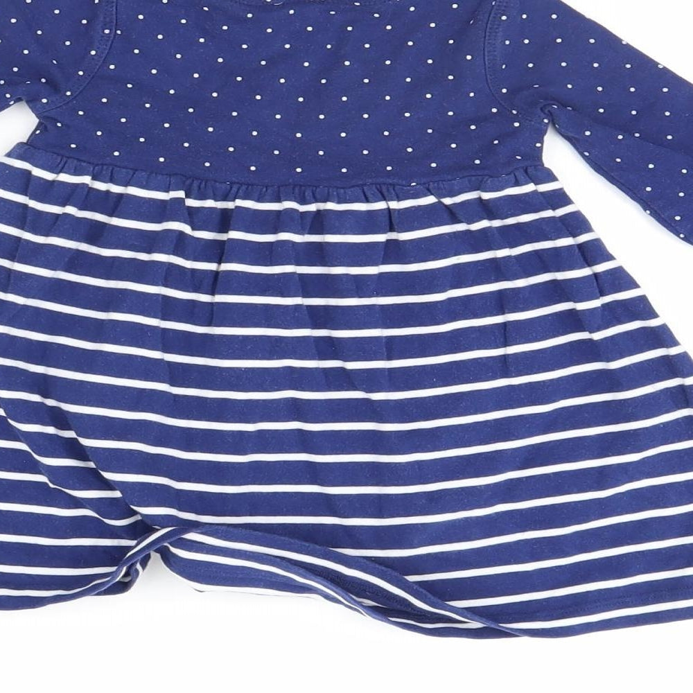 Brand and care label for Mini Club girls’ blue polka dot fit & flare, size 3-6, months