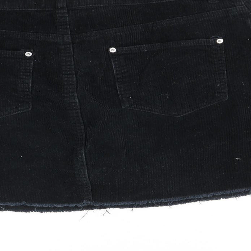 Brand and care label for Miss Selfridge women’s black a-line skirt, size UK 10