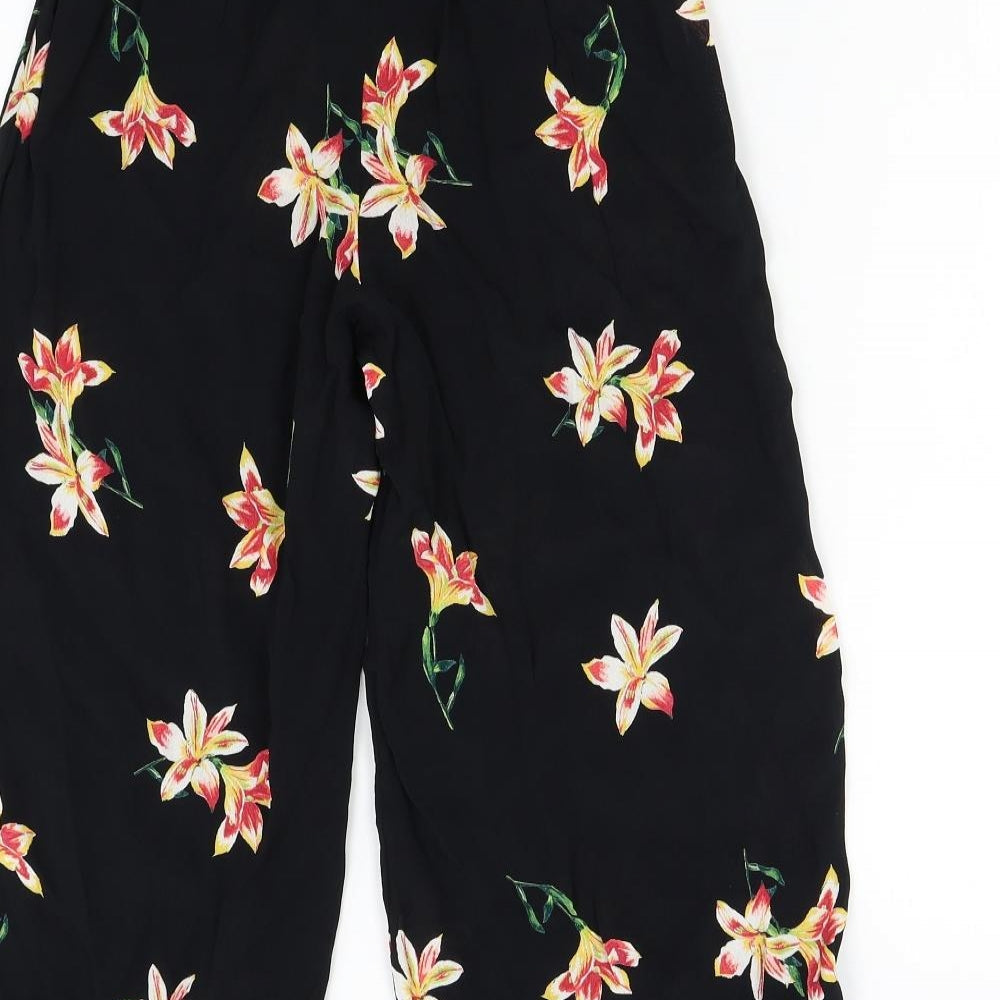 Brand and care label for Miss Selfridge women’s black floral capri trousers, size UK 6, 20-inch leg