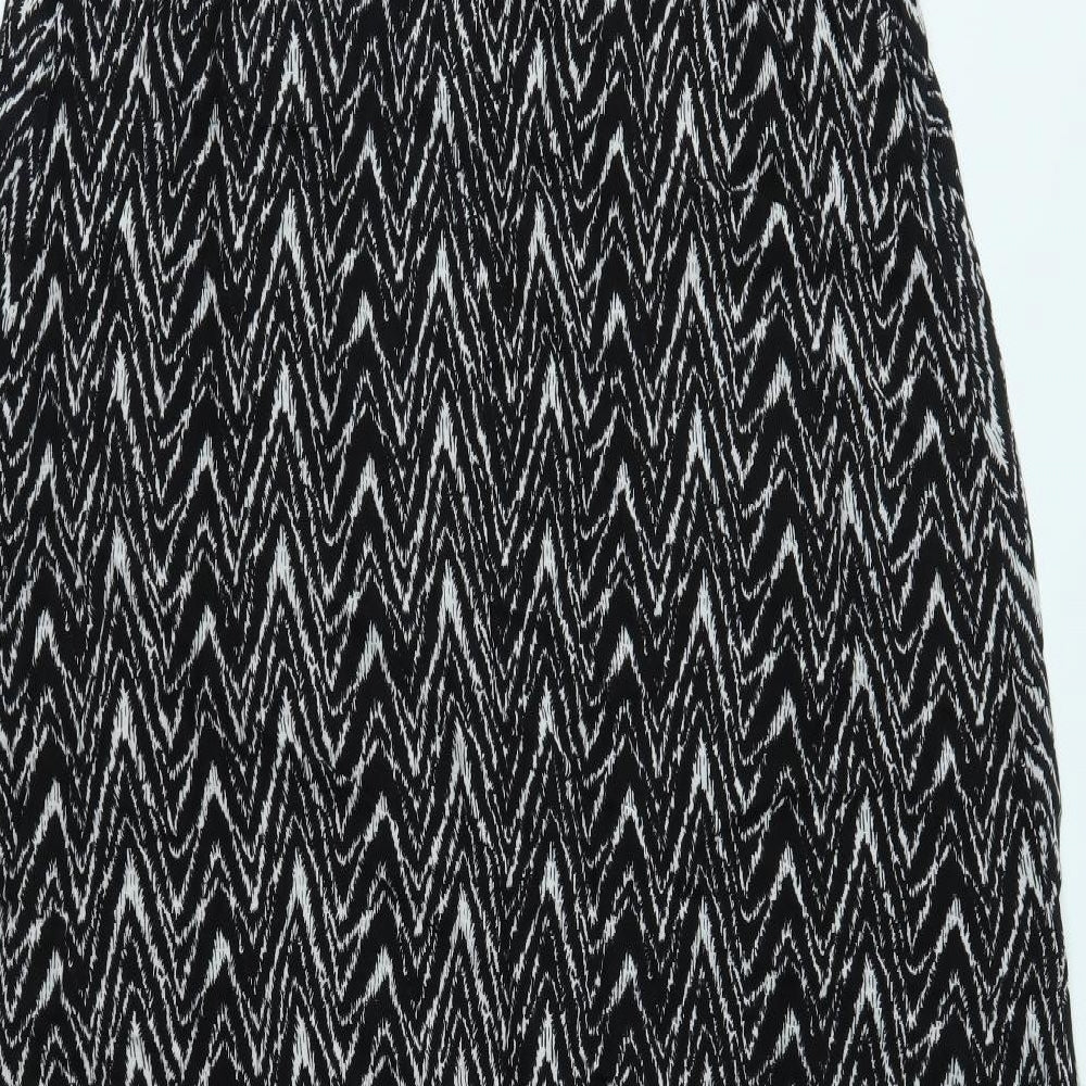 Brand and care label for Dorothy Perkins women’s black a-line, size UK 14
