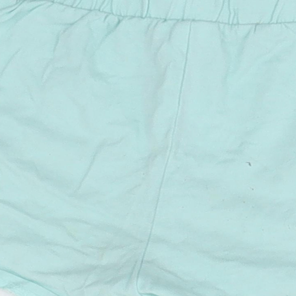 Brand and care label for Tu boys’ green sweat shorts, size 6, years - dolphin