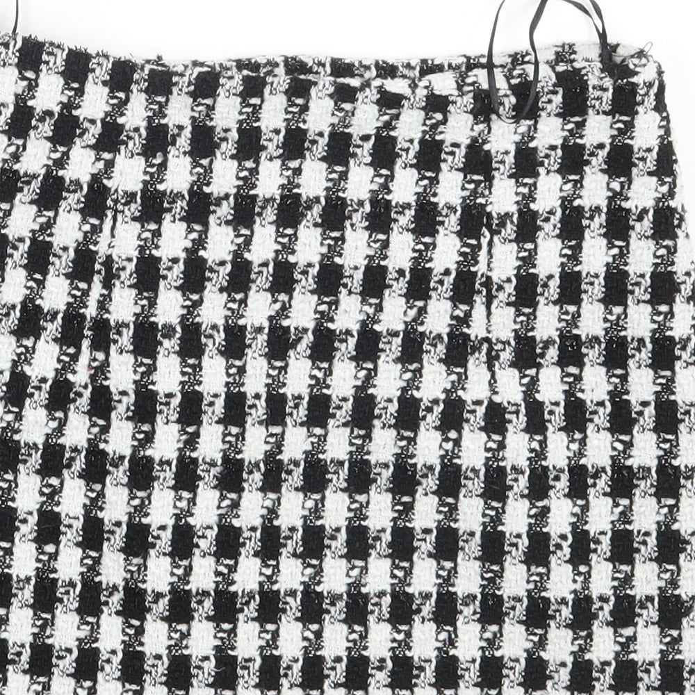 Brand and care label for SHEIN women’s black check mini skirt, size XS