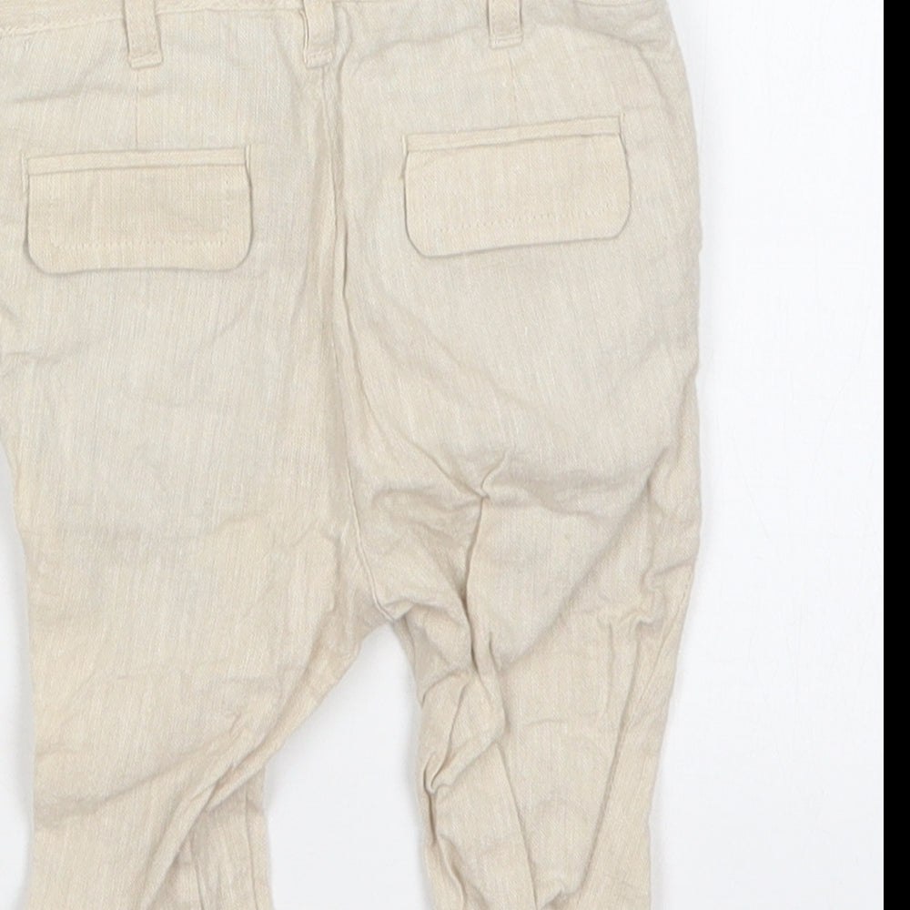 Brand and care label for Marks & Spencer boys’ beige cargo trousers, size 3-6, months