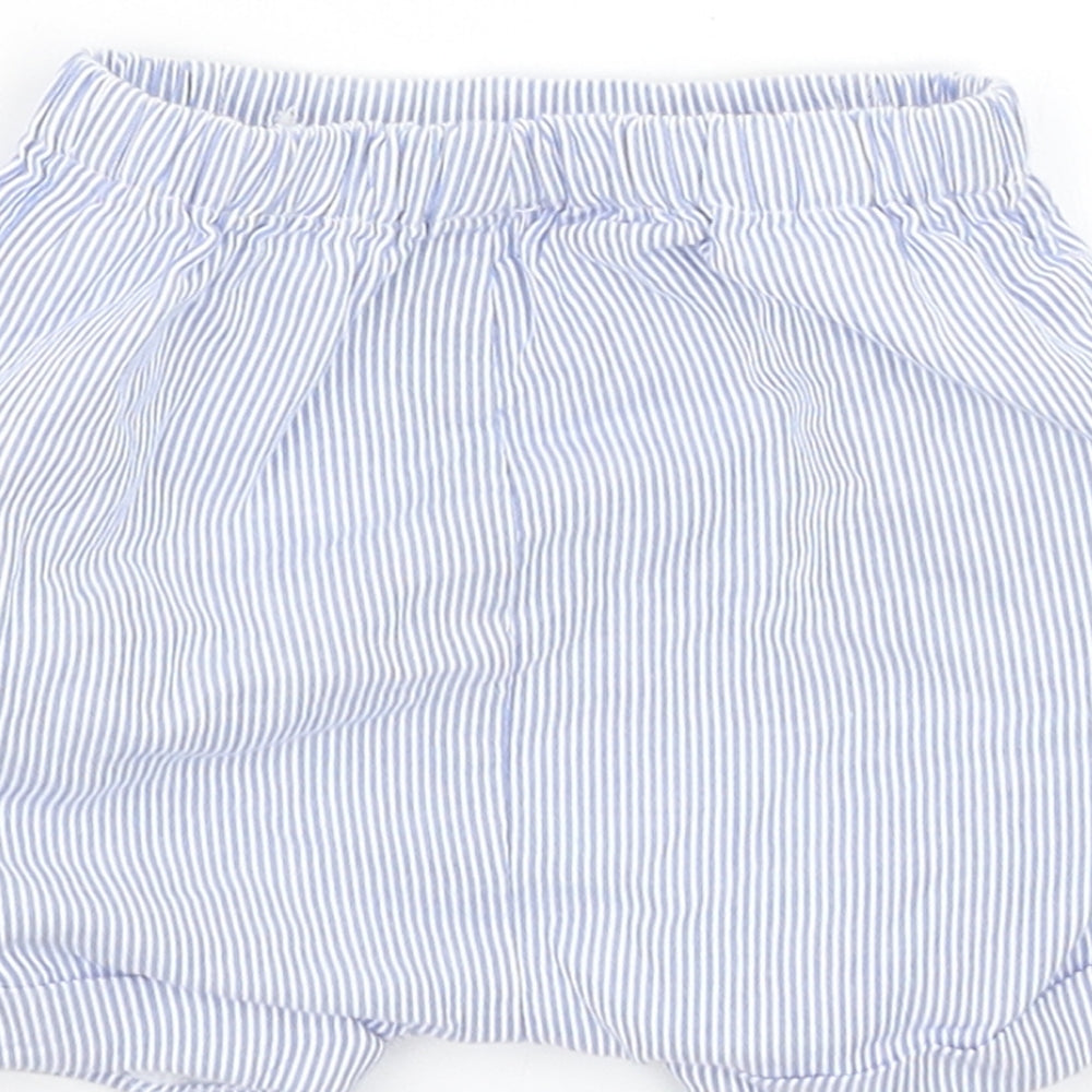 Brand and care label for Tu boys’ blue striped cropped trousers, size 0-3, months