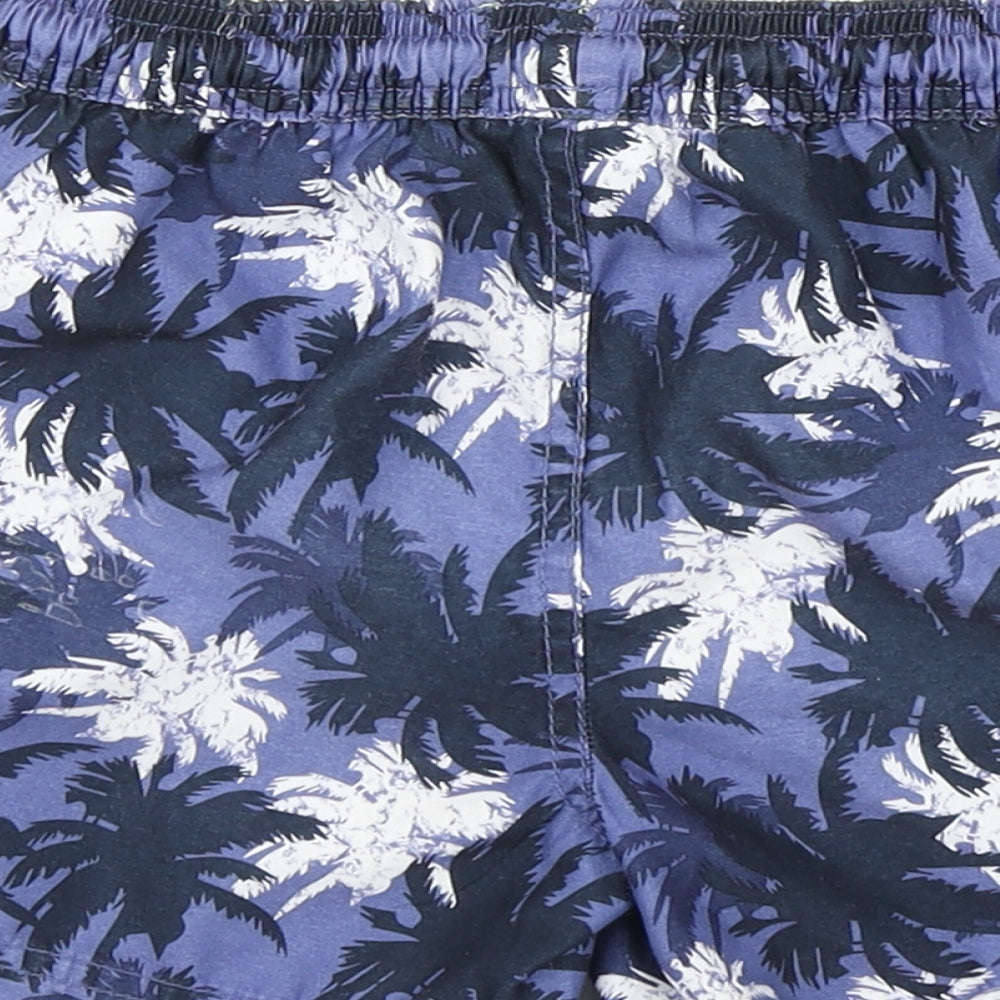 Brand and care label for Matalan boys’ blue floral sweat shorts, size 6, years