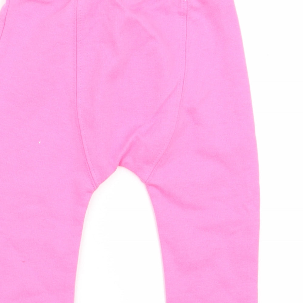 Brand and care label for F&F girls’ pink capri trousers, size 3-6, months - leggings