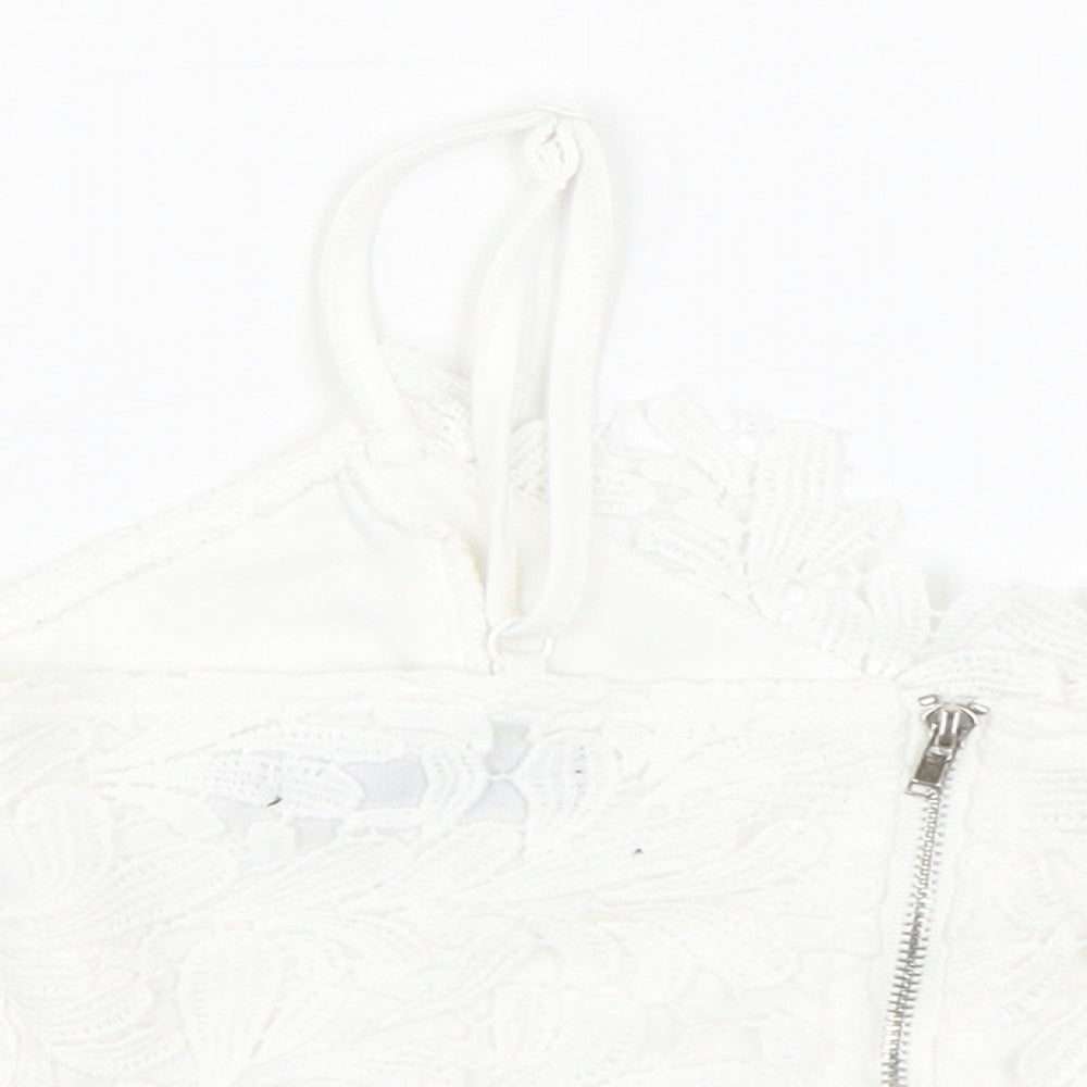 Brand and care label for Missguided women’s white floral cropped tank, size UK 4