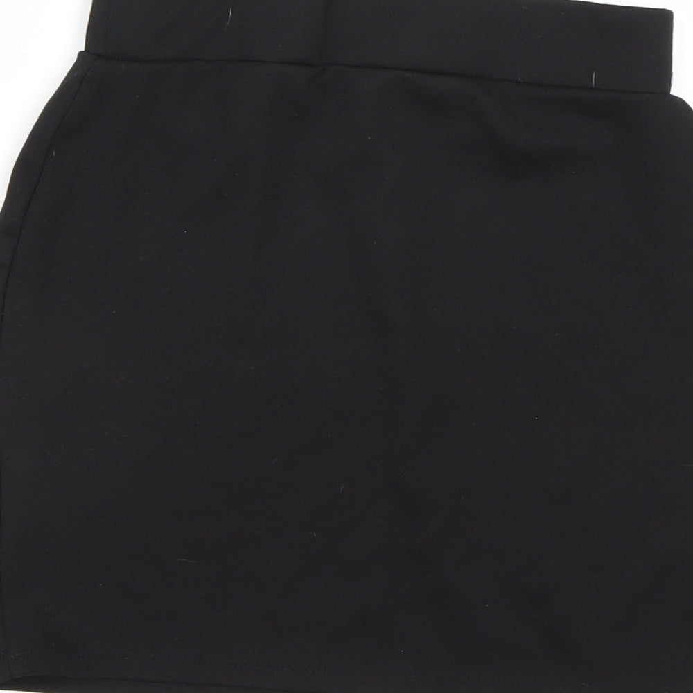 Brand and care label for George girls’ black mini skirt, size 10-11, years