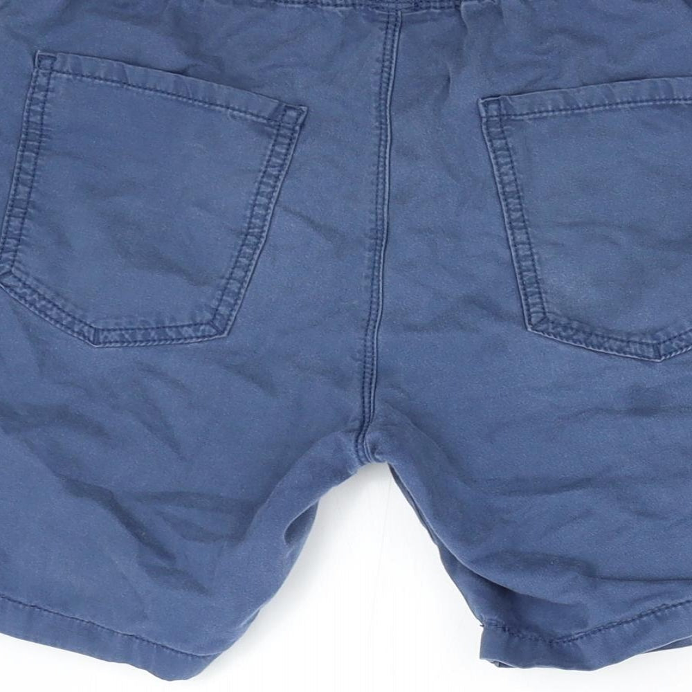 Brand and care label for Next boys’ blue bermuda shorts, size 9, years