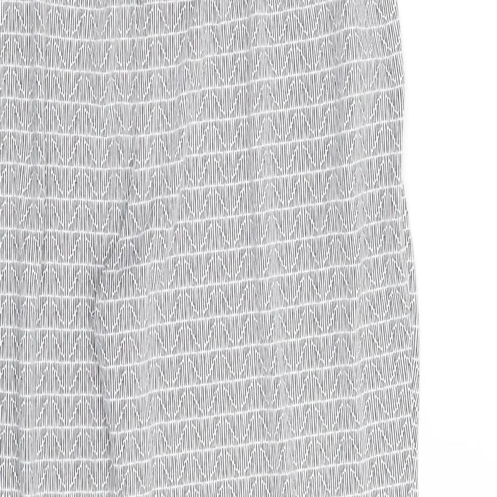 Brand and care label for ESMARA women’s white geometric trousers, size UK 14, 25-inch leg