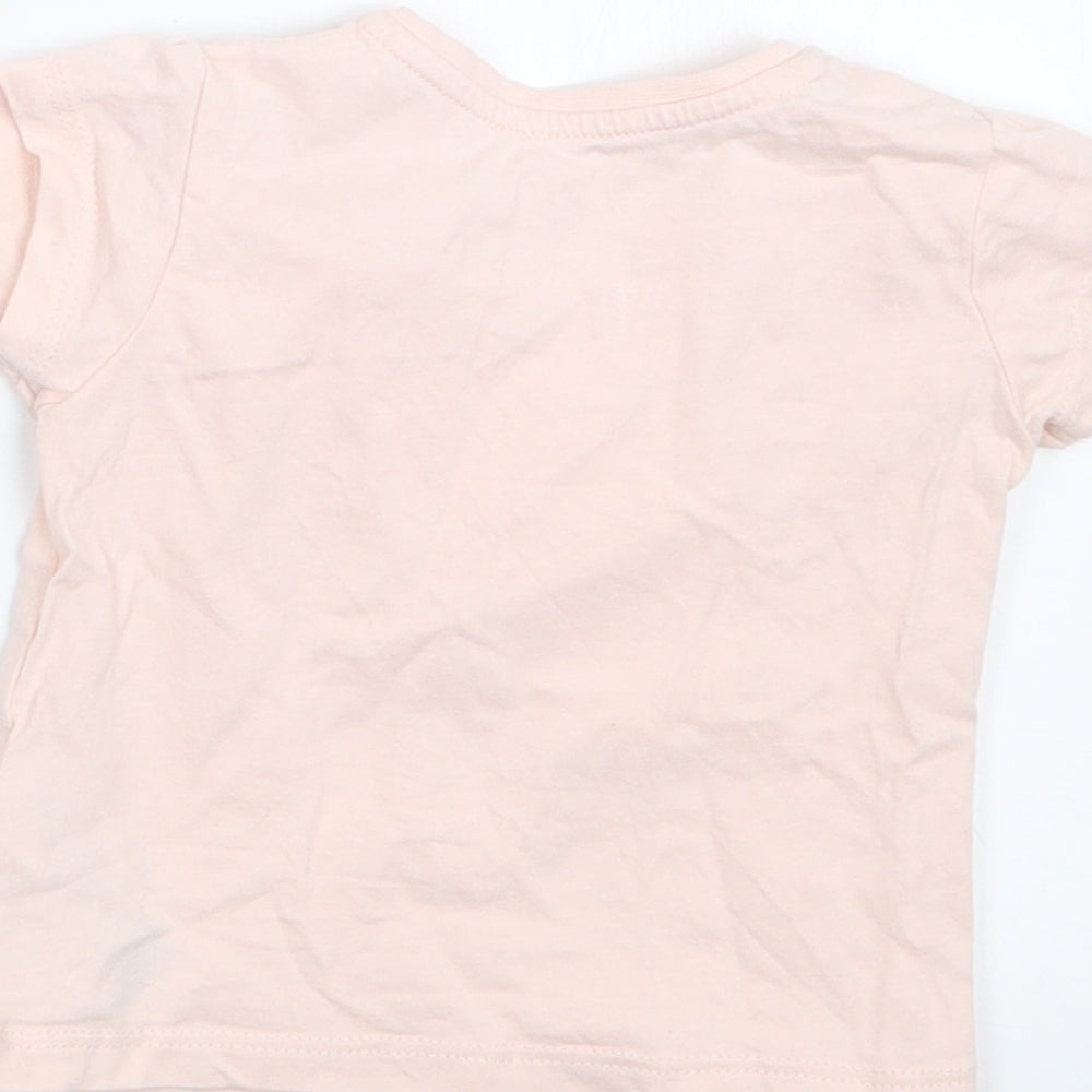 Brand and care label for Primark girls’ pink basic t-shirt, size 3-6, months