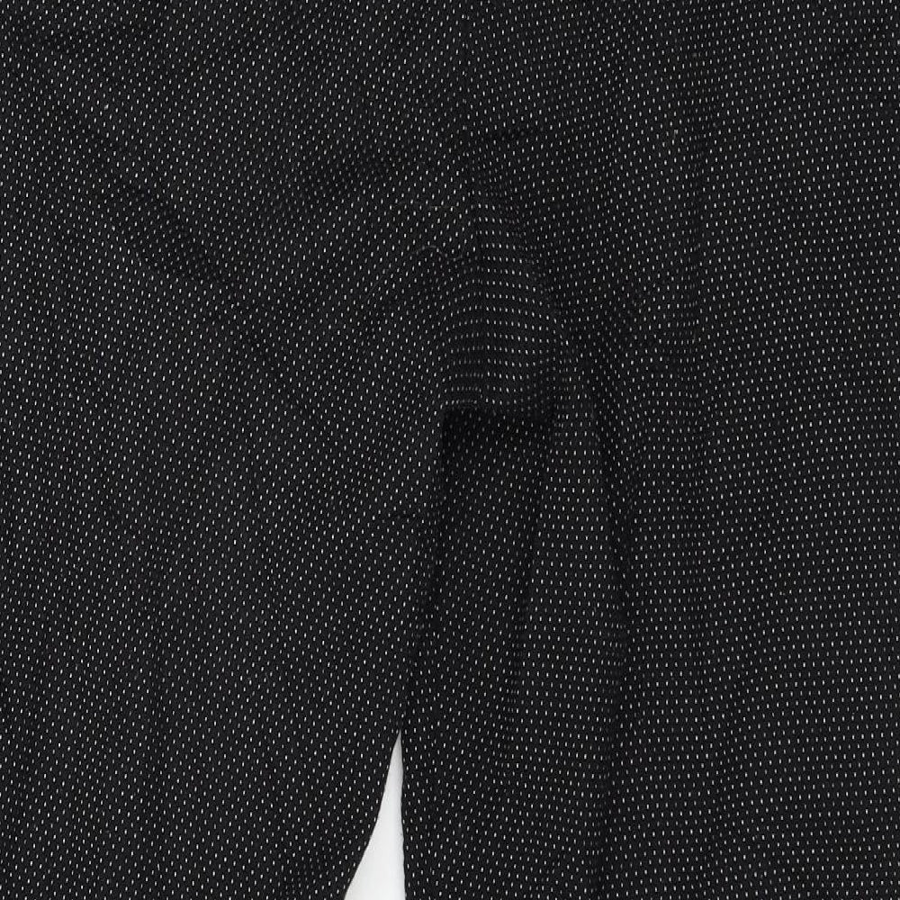 Brand and care label for Warehouse women’s black polka dot trousers, size UK 14, 27-inch leg
