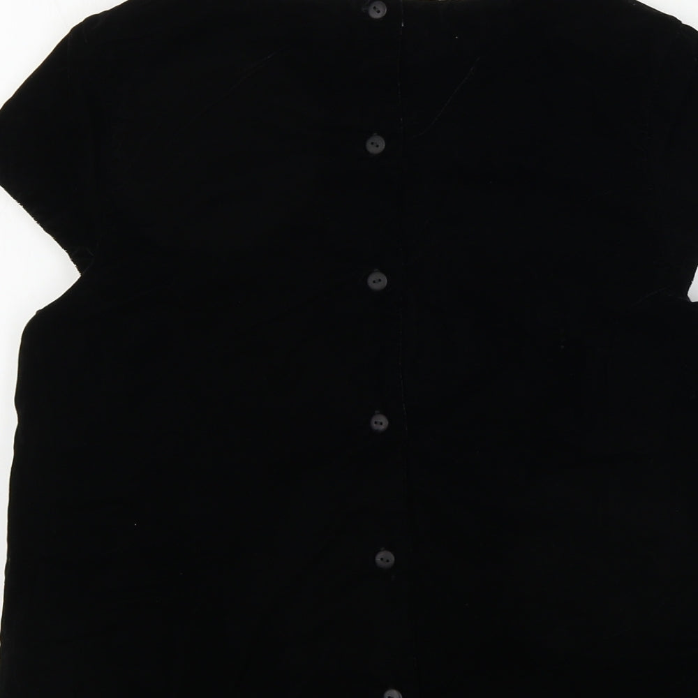 Brand and care label for Marks & Spencer girls’ black jumper, size 12-13, years